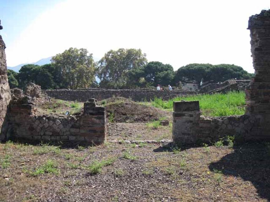 VIII.7.26 Pompeii. September 2010. South wall of atrium looking south across garden, towards Odeon. Photo courtesy of Drew Baker.
