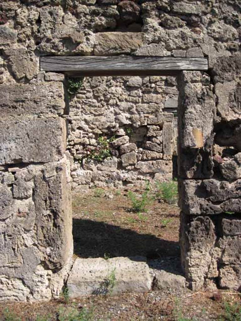 VIII.7.26 Pompeii. September 2010. Doorway from atrium into triclinium, on east side of atrium. Photo courtesy of Drew Baker.
