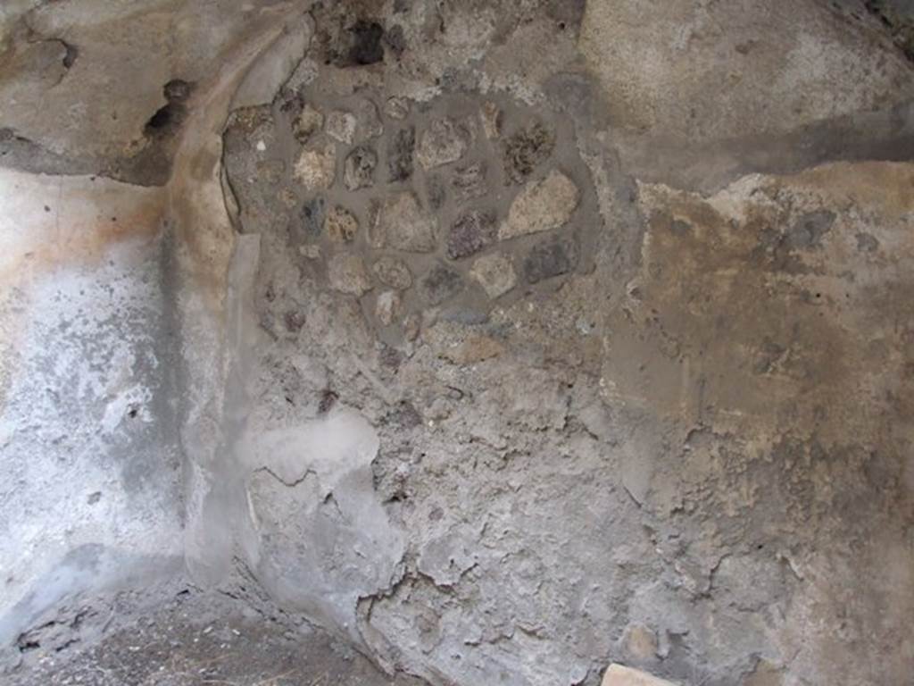 IX.1.12  Pompeii. December 2007.  East wall and arch under the stairs in room at end of corridor on north-west side of peristyle.
