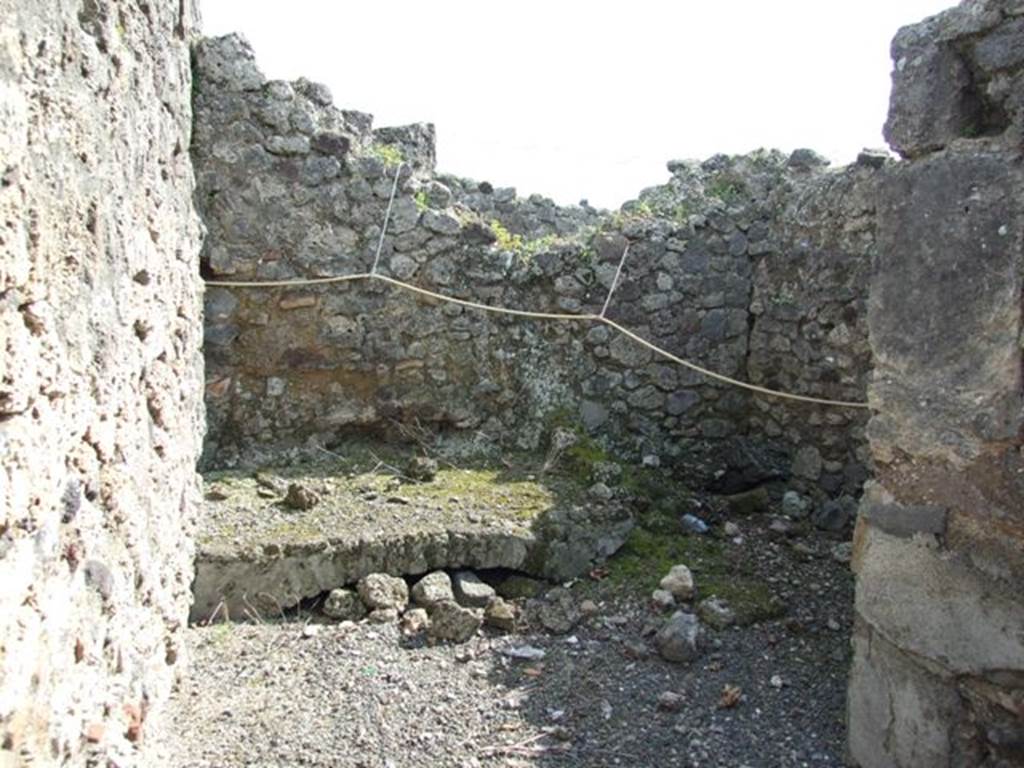 IX.2.18 Pompeii. March 2009. Room 8, kitchen. Masonry hearth, and remains of latrine against the south wall.
