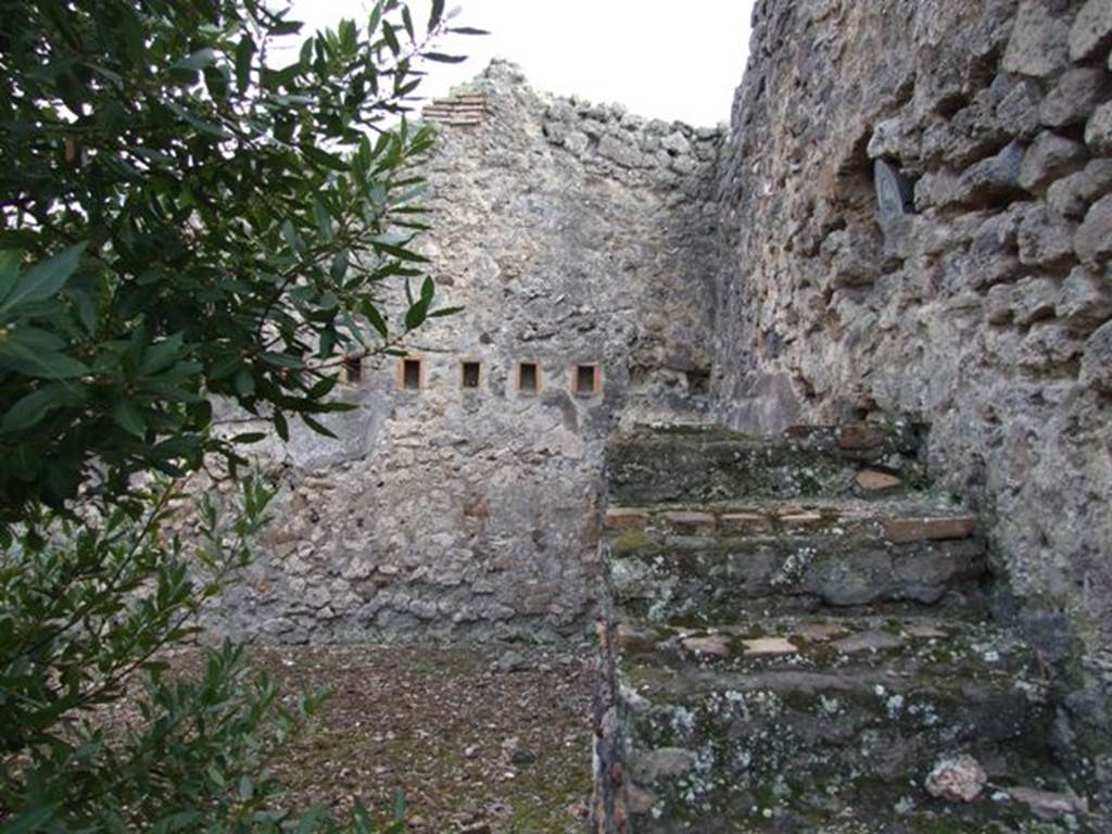 IX.2.24 Pompeii.  March 2009.   Staircase and south west corner of yard.