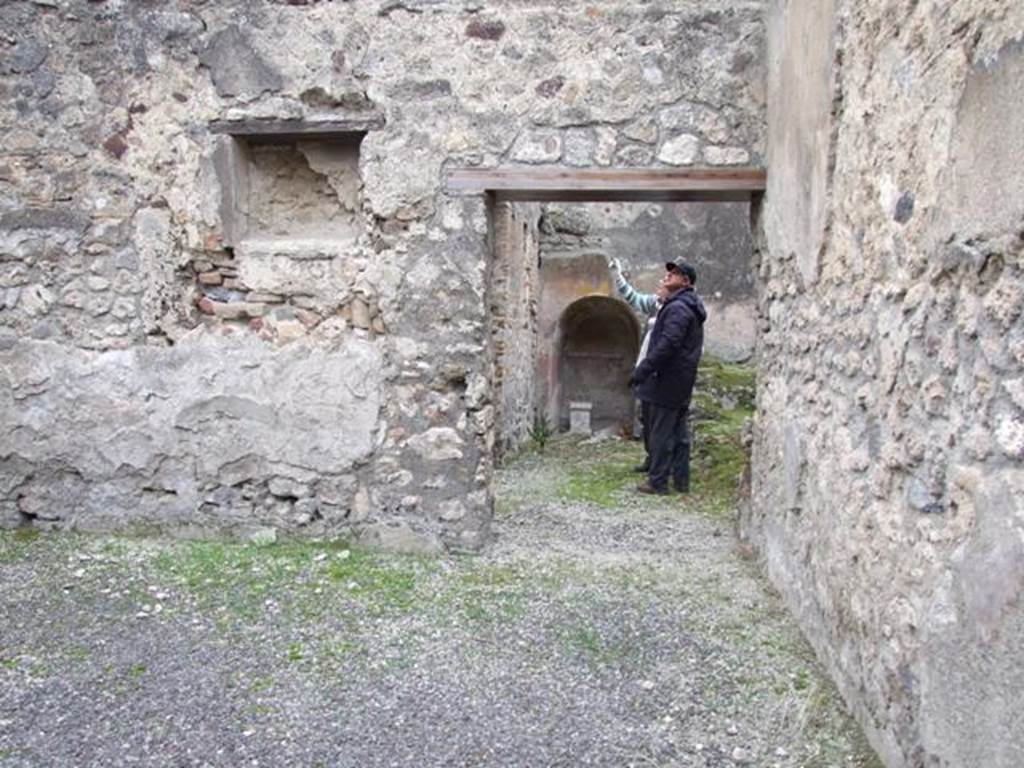 IX.3.20.  Bakery.  December 2007.  Room 6.  Niche on west wall and door into room 8.