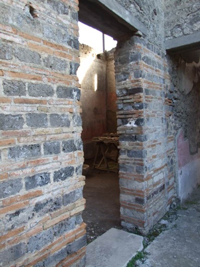 IX.5.11 Pompeii.  December 2007. Doorway to Room 4 and corridor to garden area.