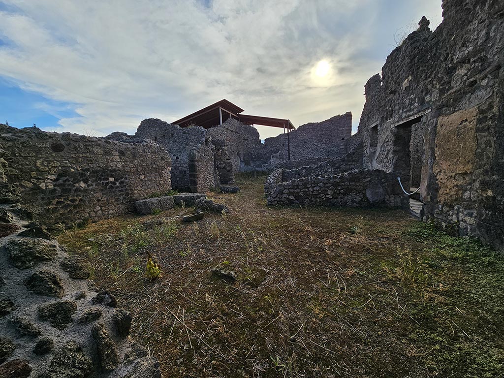 IX.7.22/21 Pompeii. November 2024. Looking south from bar-room into atrium of IX.7.21. Photo courtesy of Annette Haug.