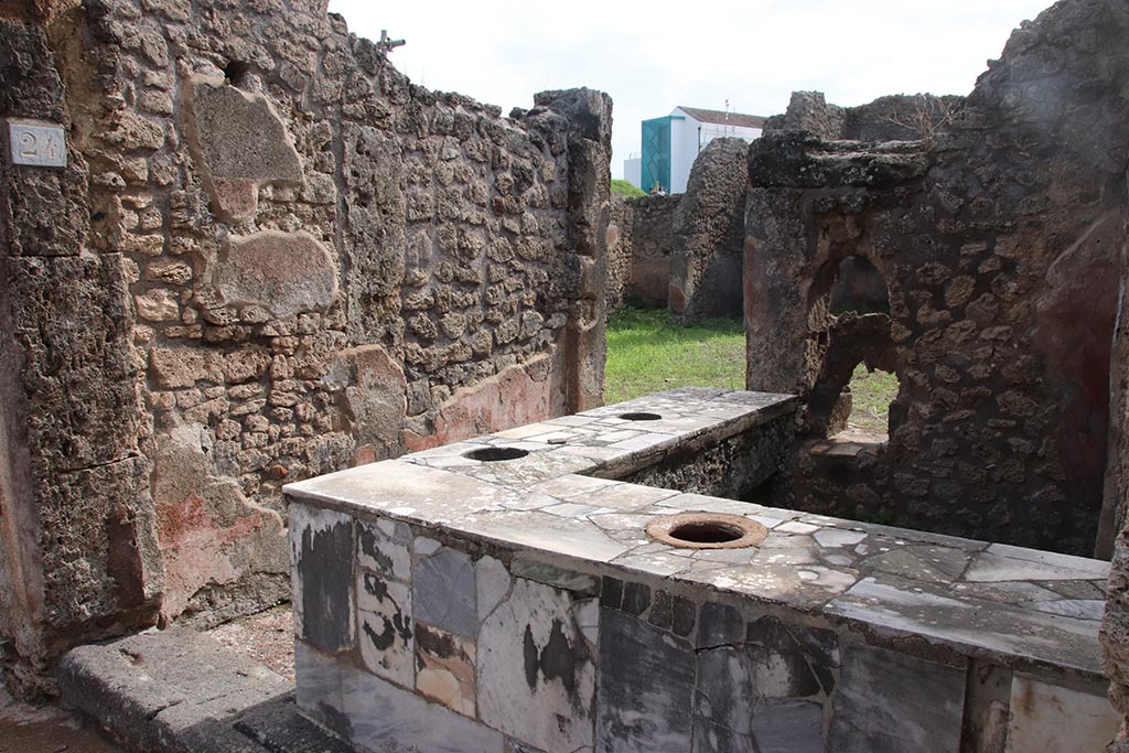 IX.7.24 Pompeii. October 2024. Looking south-east from entrance across counter. Photo courtesy of Klaus Heese.