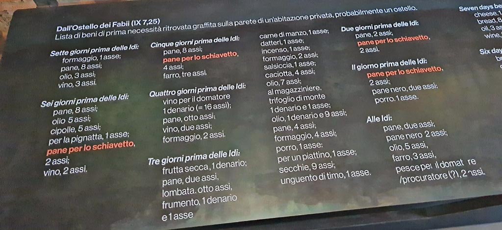 IX.7.25 Pompeii. March 2024. 
Scheda informativa con i dettagli del graffito dell’atrio, esposto nella mostra dal titolo -
“L’altra Pompei, vite comuni all’ombra del Vesuvio”. Photo courtesy of Giuseppe Ciaramella.
