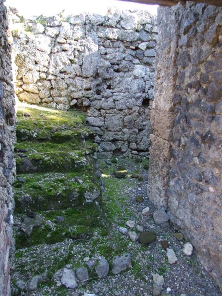 IX.9.d Pompeii. March 2009. Room h, stairs to upper floor, looking south. 
The continuation for the wooden stairs can be just seen on the south wall.

 
