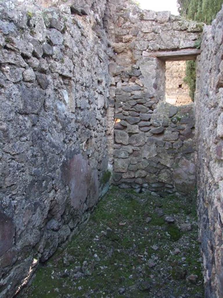 IX.9.d Pompeii. March 2009. Room i, one end of an L-shaped room with stairs at one end, and latrine underneath. Looking west into area of room of latrine. 