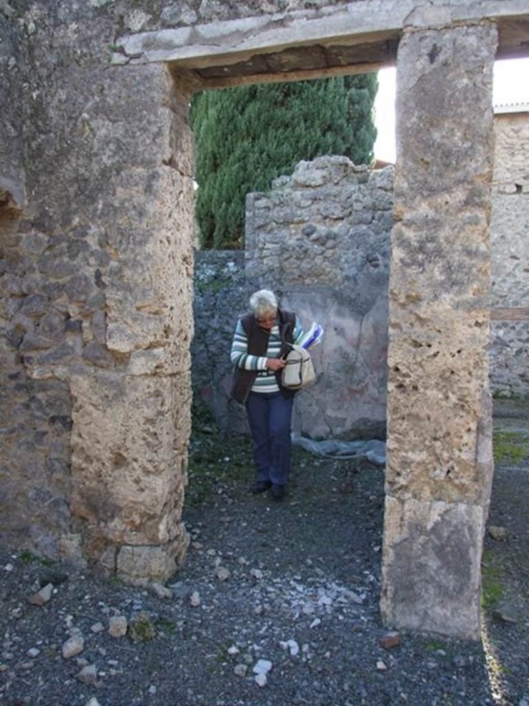 IX.9.d Pompeii. March 2009. Doorway to room k, kitchen, looking west. According to NdS, the kitchen was lit by a window.
