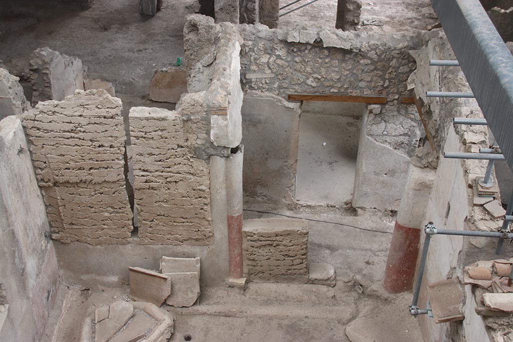 IX.12.4 Pompeii. October 2024. Small courtyard “m”, doorway in south wall, into corridor “m1” with room “d” opposite. Photo courtesy of Klaus Heese.