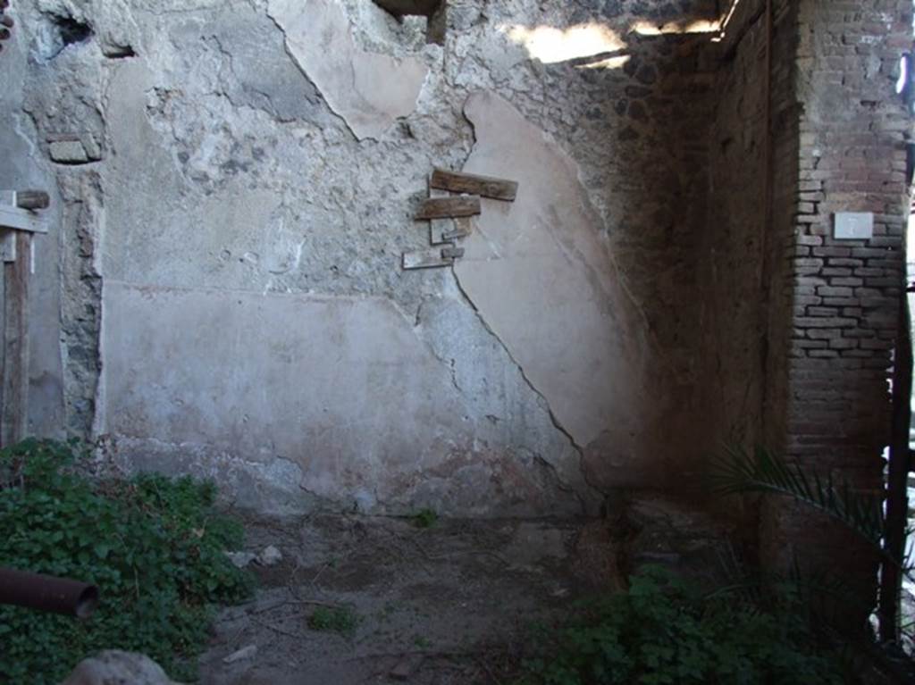 IX.12.7 Pompeii. March 2009. East wall of shop-room 1, with the outline of stairs against the wall. 

