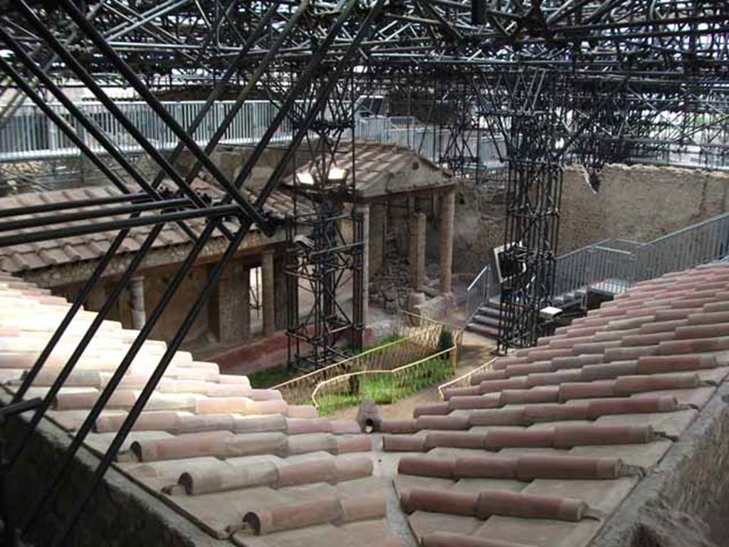 IX.12.9 Pompeii. May 2010. Looking south-east across roof of portico of garden area 5.

