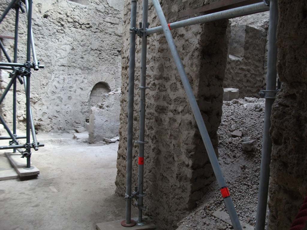 IX.12.9 Pompeii. May 2010. Looking east from portico 5c, into room 1, kitchen, and small room 2, unexcavated on right.

