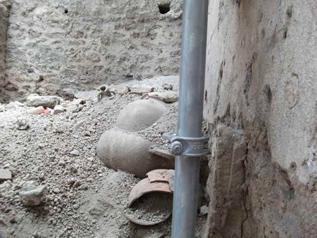 IX.12.9 Pompeii. May 2010. Room 2, looking south into unexcavated room with amphorae.