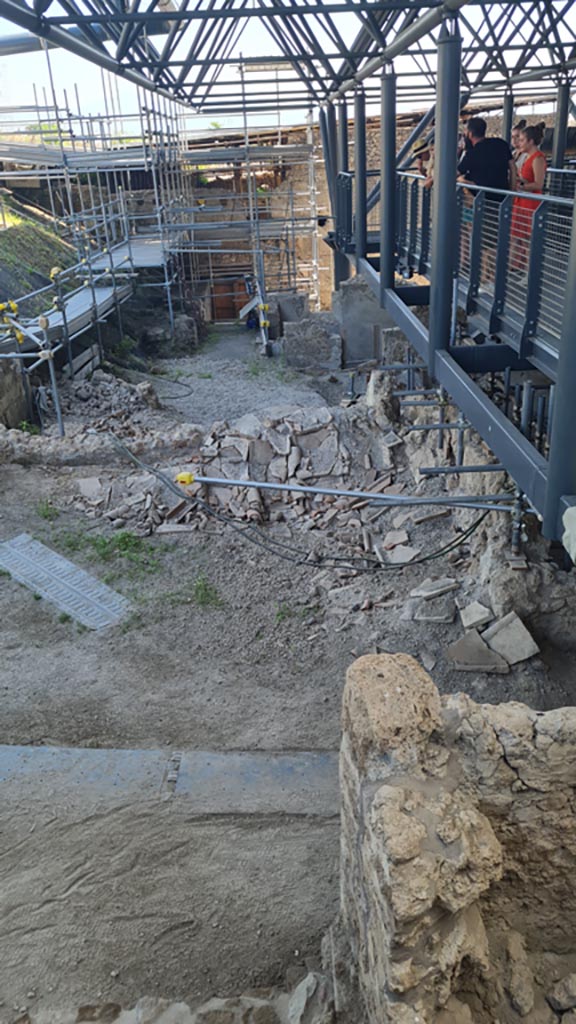 IX.12.B Pompeii. June 2024. 
Looking east along rear of insula from north-west corner. 
The collapsed roof is shown in the area of number 20/19 on the plan.
Photo courtesy of Giuseppe Ciaramella.
.

