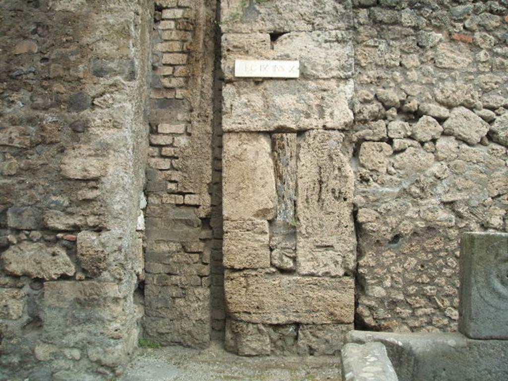 Modern bridge support (on left) is blocking the road between IX.14 and IX.10. May 2006.
Brickwork in centre is the remains of a water tower. Large stone blocks and infill to right are the corner of IX.10.2. 
