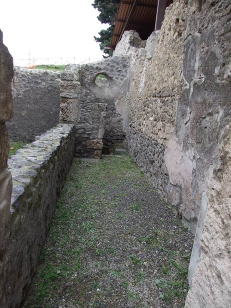 IX.14.4 Pompeii. December 2007. Looking east across room 8 towards latrine.