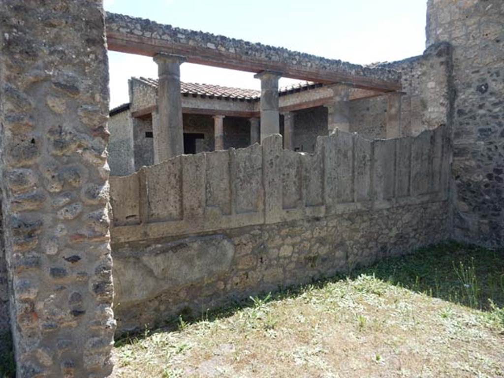 IX.14.4 Pompeii. May 2017. 
Triclinium, looking south-west towards the side of the parapet wall showing the plaster-cast of the wooden shutters.
Photo courtesy of Buzz Ferebee.

