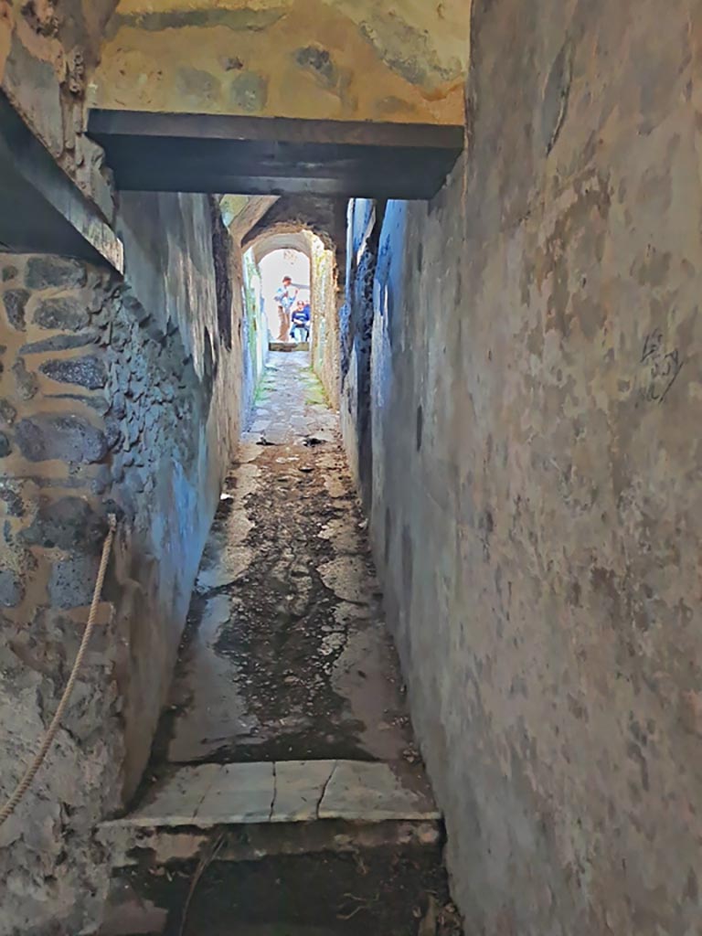 HGW24 Pompeii. March 2024. 
Looking east along corridor 5,12 towards upper floor, in north-east corner of portico.
Photo courtesy of Giuseppe Ciaramella.
