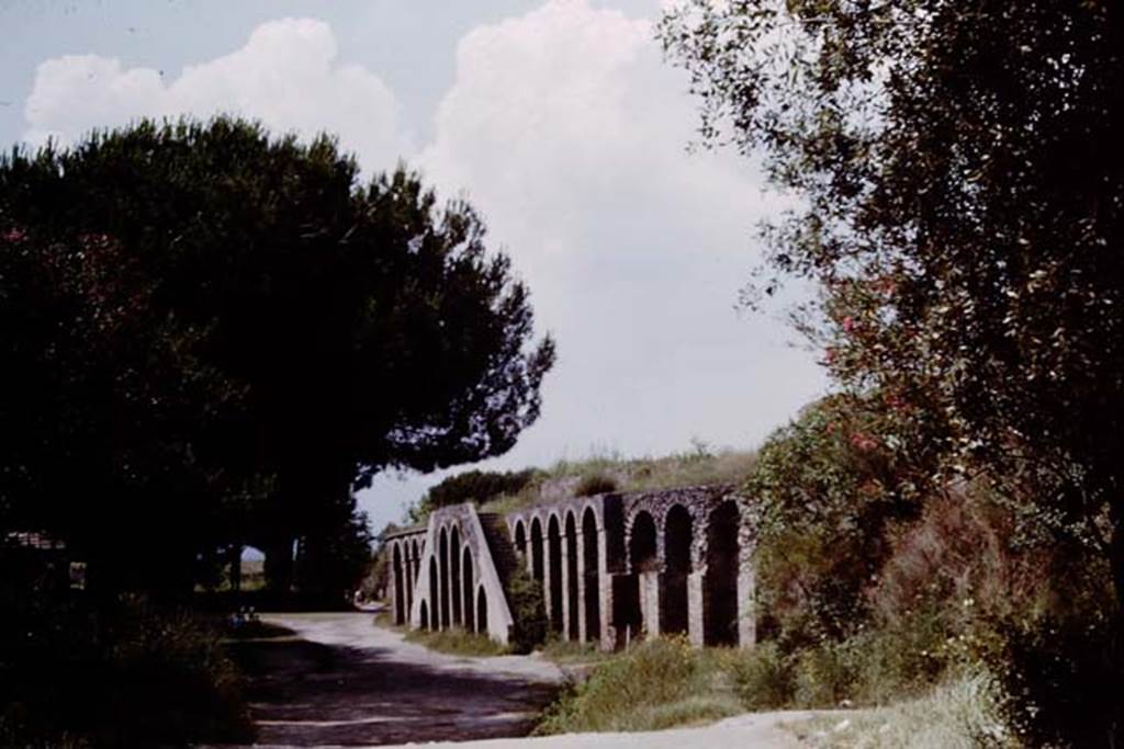 Piazzale Anfiteatro, Pompeii. 1964. Looking north from Viale Anfiteatro.  Photo by Stanley A. Jashemski.
Source: The Wilhelmina and Stanley A. Jashemski archive in the University of Maryland Library, Special Collections (See collection page) and made available under the Creative Commons Attribution-Non Commercial License v.4. See Licence and use details.
J64f1363
