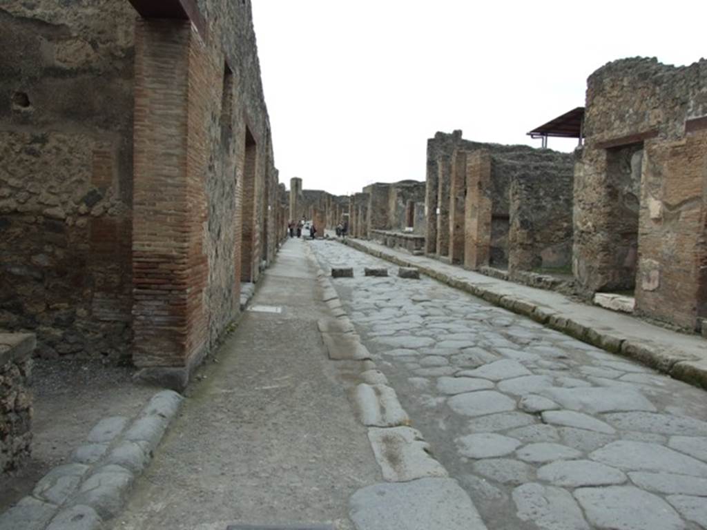 Via dell’Abbondanza between I.4 and IX.1. Looking west from I.4.27. March 2009.