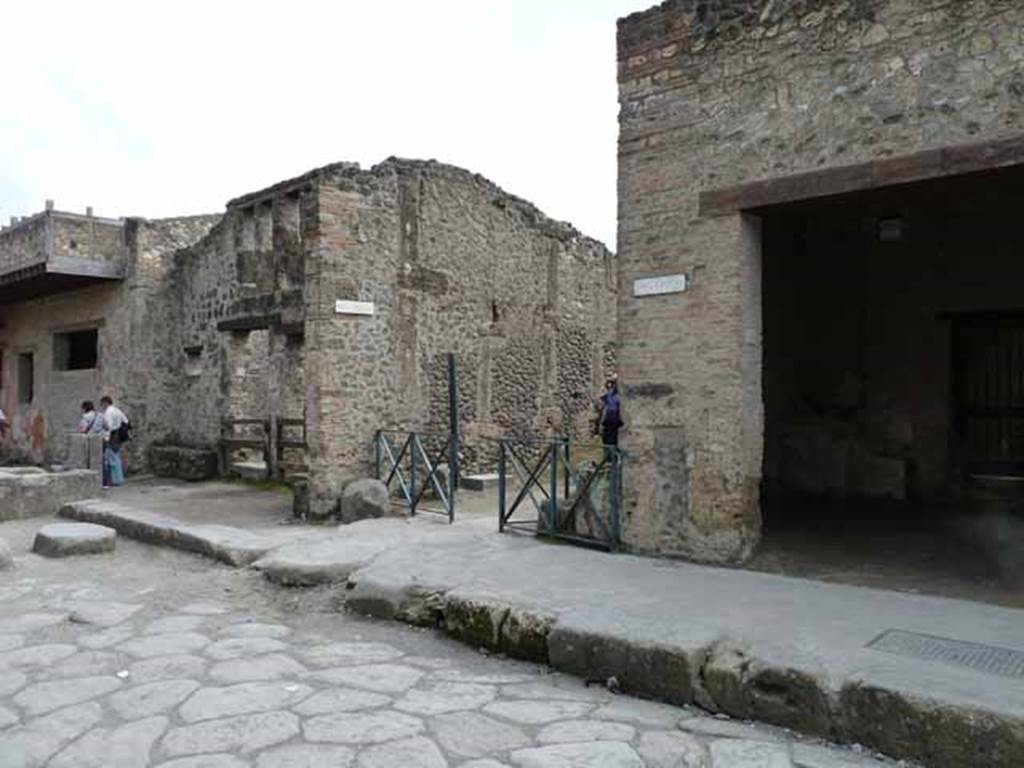 Via dell’Abbondanza, south side. May 2010. Looking towards junction with Vicolo della Nave Europa, between I.12 and I.11.