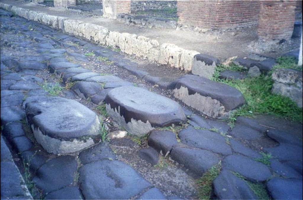 Via della Fortuna. July 2011.  Looking west towards stepping stones in via near fountain. Photo courtesy of Rick Bauer.
