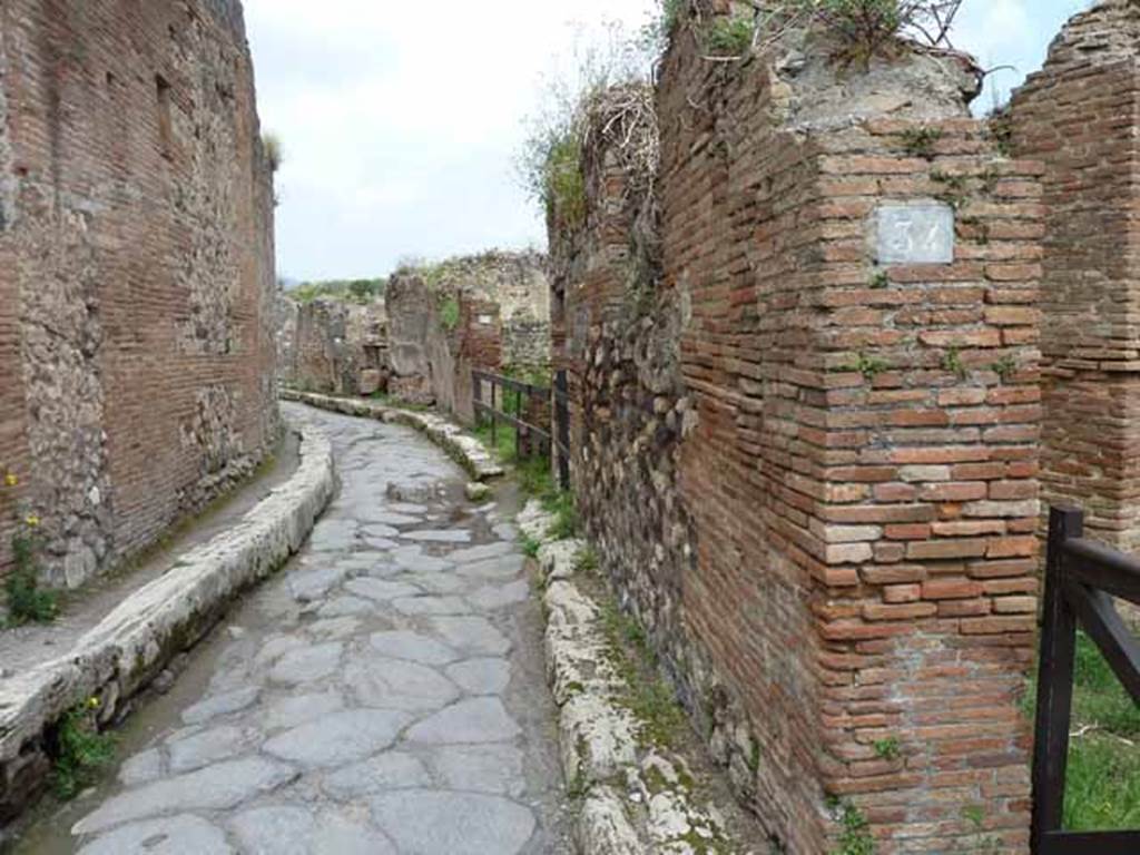 Vicolo Storto, May 2010. Looking north between VII.4 and VII.3, from near VII.3.34.