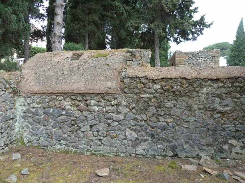 Pompeii Porta Nocera. May 2010. Tomb 9ES in the foreground. Looking west to wall adjoining underground room of 7ES. 
