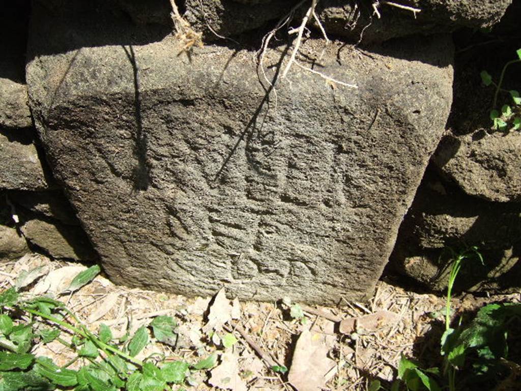 SGH Pompeii. May 2006. According to Mau: The memorial tablet belonging to the monument nearest the gate has disappeared, but two boundary stones at the corners of the lot bear the Latin inscription : 
M. Tullio M. f. ex D(ecurionem) D(ecreto)
'To Marcus Tullius son of Marcus, in accordance with a vote of the city council.' The Tullius named was perhaps the builder of the temple of Fortuna Augusta. See Mau, A., 1907, translated by Kelsey F. W. Pompeii: Its Life and Art. New York: Macmillan. (p.422-3, p.126). The Epigraphik-Datenbank Clauss/Slaby (See www.manfredclauss.de) has the entry as 
M(arco) Tullio / M(arci) f(ilio) / ex d(ecreto) d(ecurionum) [EE-08-01, 00330 = EE-08-01, 00857d]