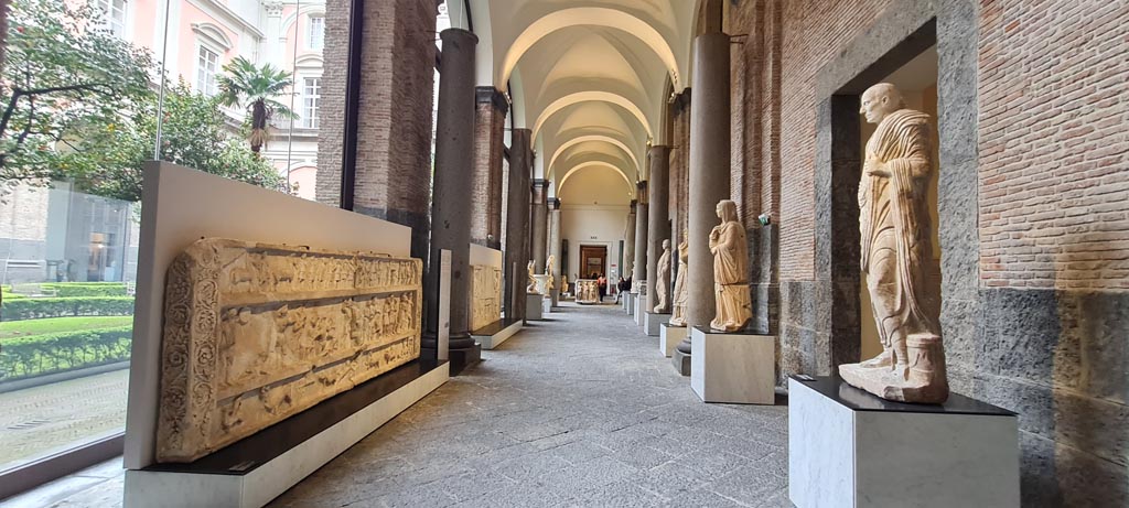 SG7 Pompeii. April 2023. Relief showing gladiatorial displays from tomb at Stabian Gate, inv. 6704, on left.
Looking along “Campania Romana” gallery in Naples Archaeological Museum. Photo courtesy of Giuseppe Ciaramella.

